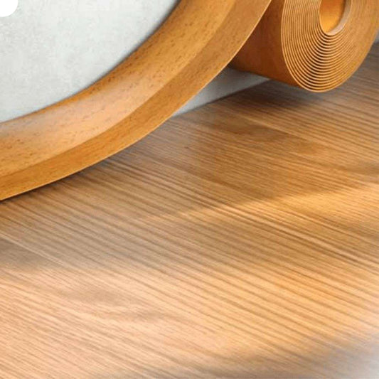 Wooden flooring roll on a wooden floor