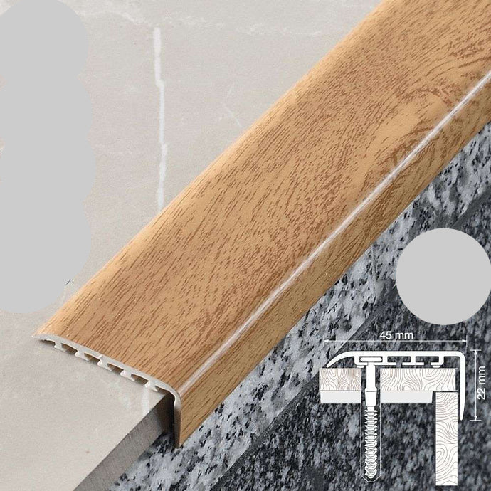 Wooden floor trim with UPVC label and dimensions on a tiled floor background